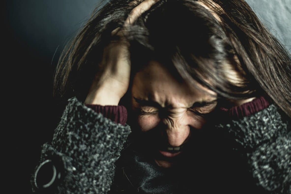 Emotional Hangovers Can Sneak Up on You—Why They Happen and How to Cope Girl-holding-her-head